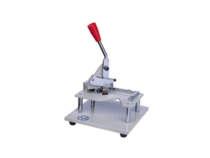 Vertical pressure sample cutting instrument