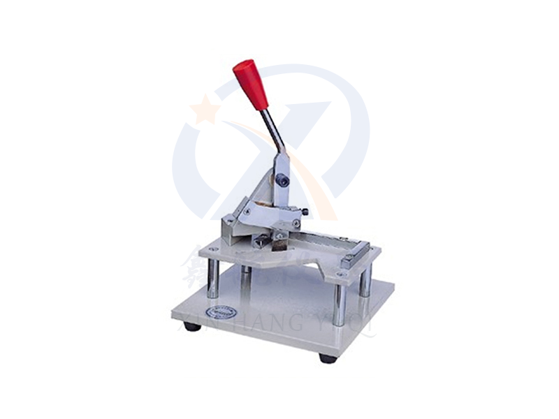 Vertical pressure sample cutting instrument